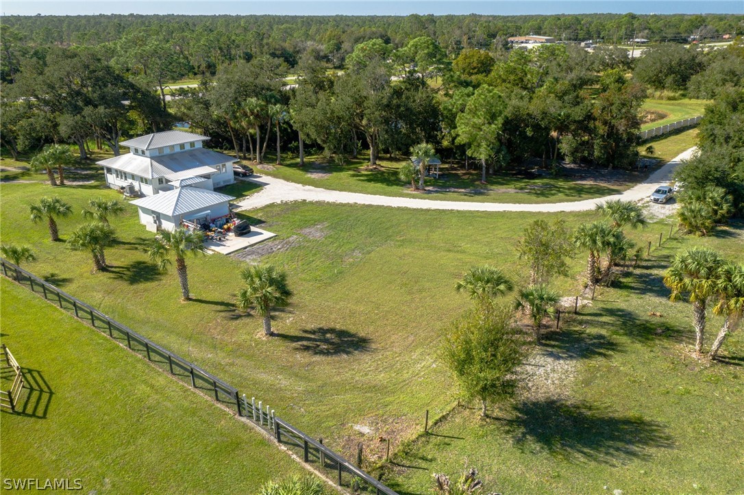2071 Balsey Road Alva, FL 33920 - Photo 1 of 34 a view of a swimming pool with a yard