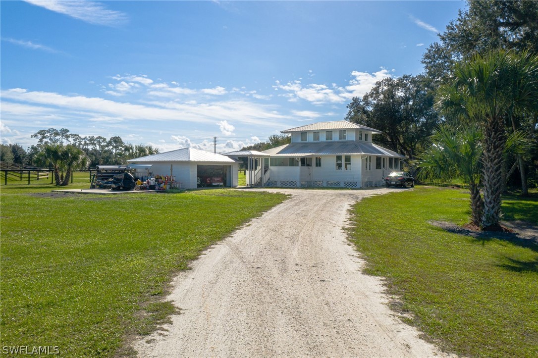 2071 Balsey Road Alva, FL 33920 - Photo 33 of 34 a view of a house with a big yard