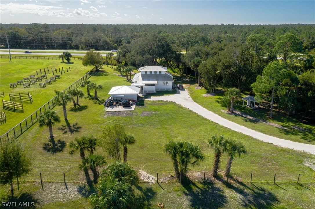 2071 Balsey Road Alva, FL 33920 - Photo 8 of 34 a view of a swimming pool with a yard