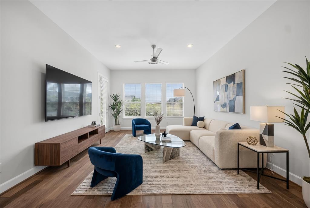 5015 Meridian Lane, Unit 2102 Addison, TX 75001 - Photo 1 of 36 Spacious living area featuring wood-finish flooring, recessed lighting, and a ceiling fan