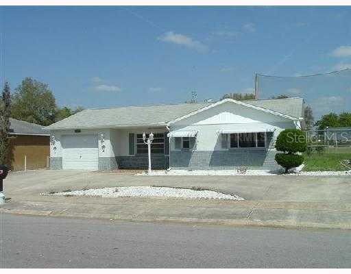 6207 Langston Avenue New Port Richey, FL 34653 - Photo 1 of 1 a house with a yard