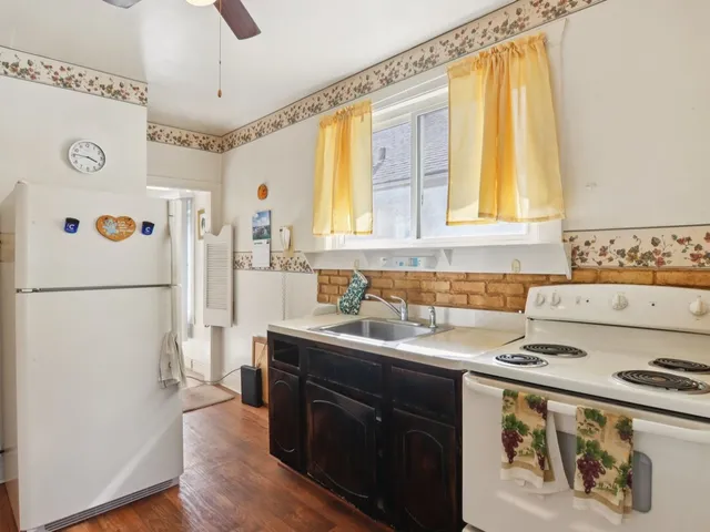 a kitchen with a sink and a window