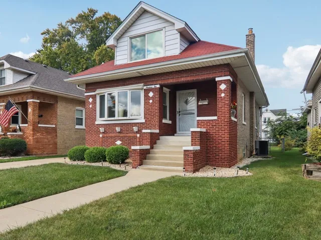 front view of a house with a yard