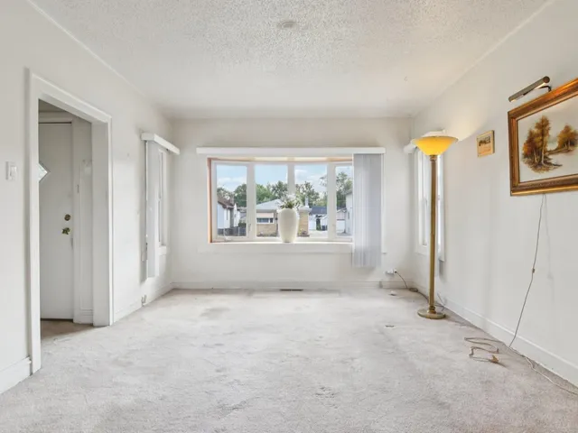a view of a livingroom with a furniture and a ceiling fan
