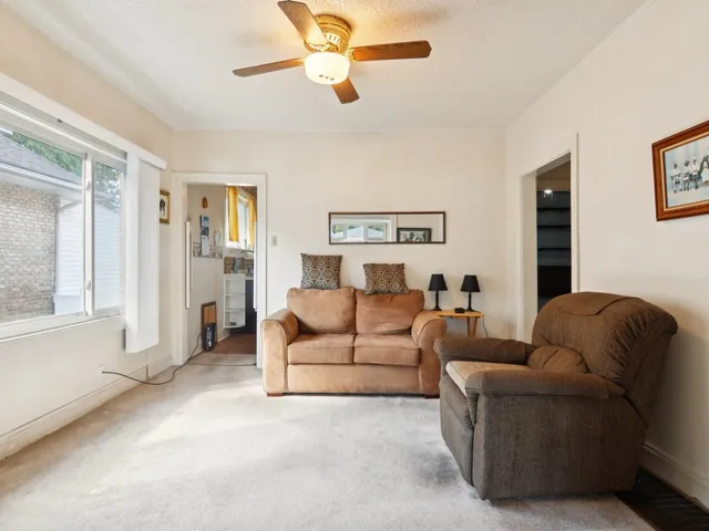 a kitchen with a refrigerator and a sink
