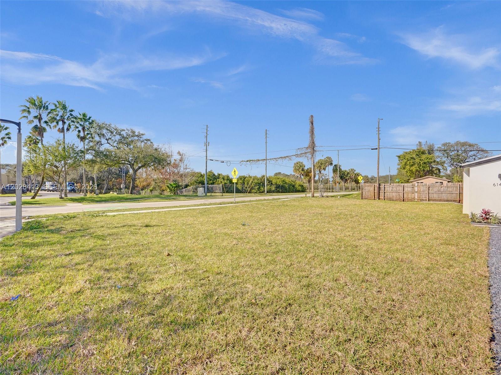 6147 Southwest 40th Street Miramar, FL 33023 - Photo 1 of 4 a view of a large building with a yard