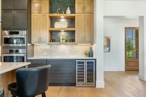 a dining room with furniture window and wooden floor