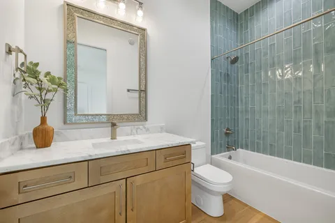 a dining room with furniture window and wooden floor