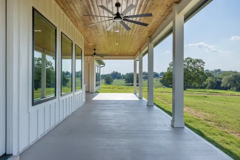 a view of a swimming pool and a yard