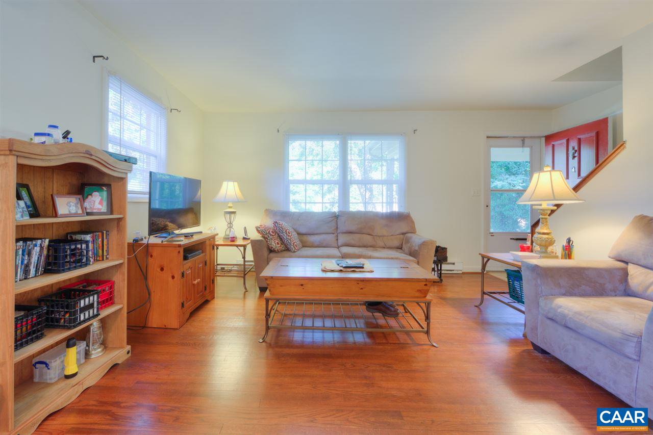 1709 Cedar Hill Road Charlottesville, VA 22901 - Photo 4 of 17 a living room with furniture and a book shelf