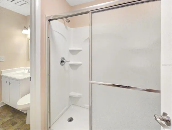 a bathroom with a shower and a toilet