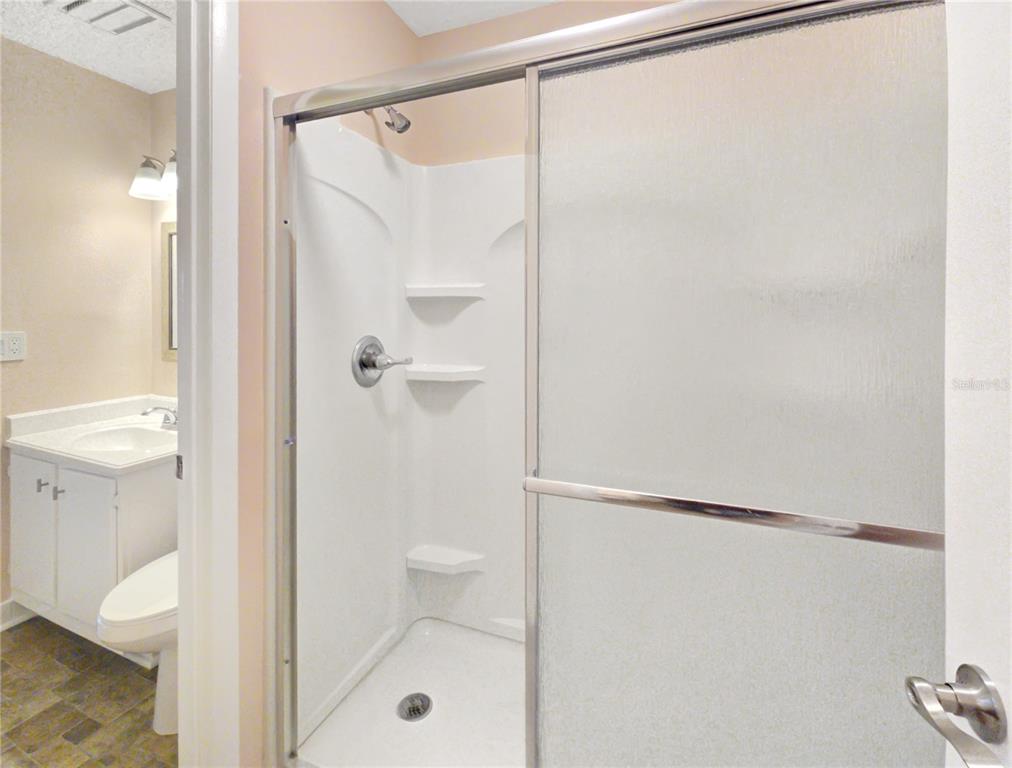 504 Silver Drive, Unit A Ocala, FL 34472 - Photo 12 of 28 a bathroom with a shower and a toilet