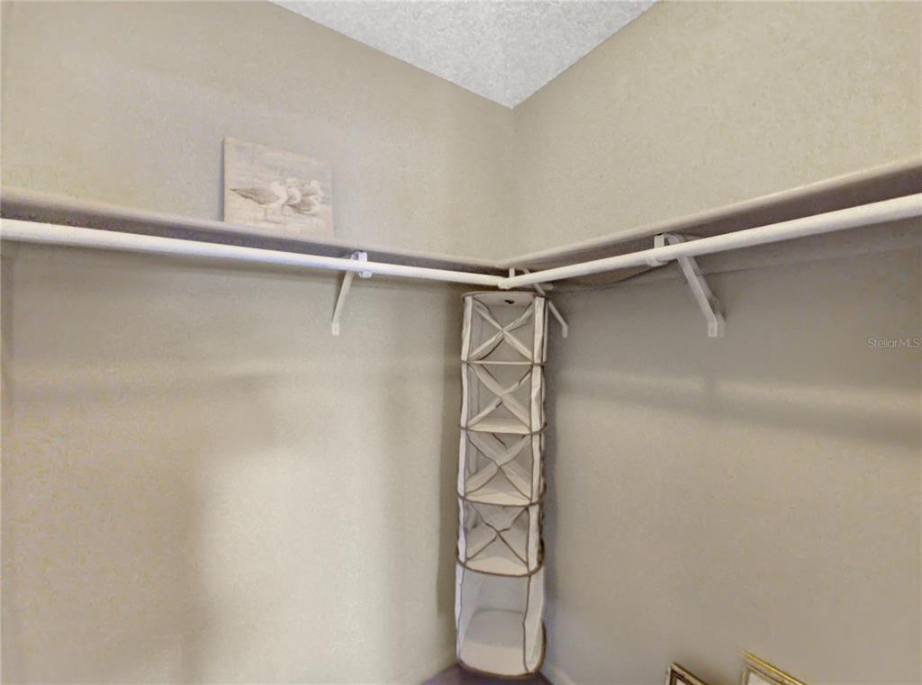 504 Silver Drive, Unit A Ocala, FL 34472 - Photo 16 of 28 a view of walk in closet with empty racks