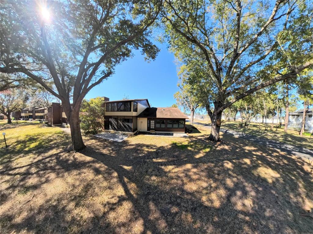504 Silver Drive, Unit A Ocala, FL 34472 - Photo 22 of 28 a tree in the middle of a yard
