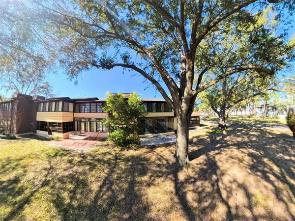 a house with trees in front of it