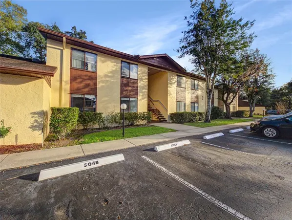 a view of a house with a cars park