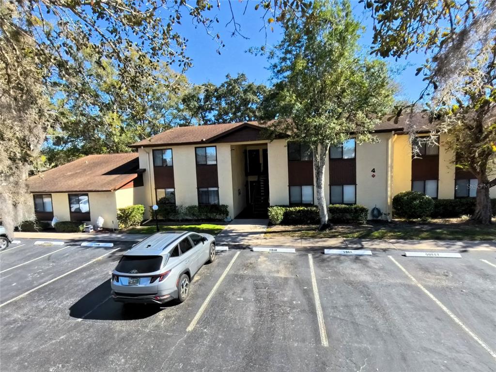 504 Silver Drive, Unit A Ocala, FL 34472 - Photo 4 of 28 a front view of a house with yard and trees