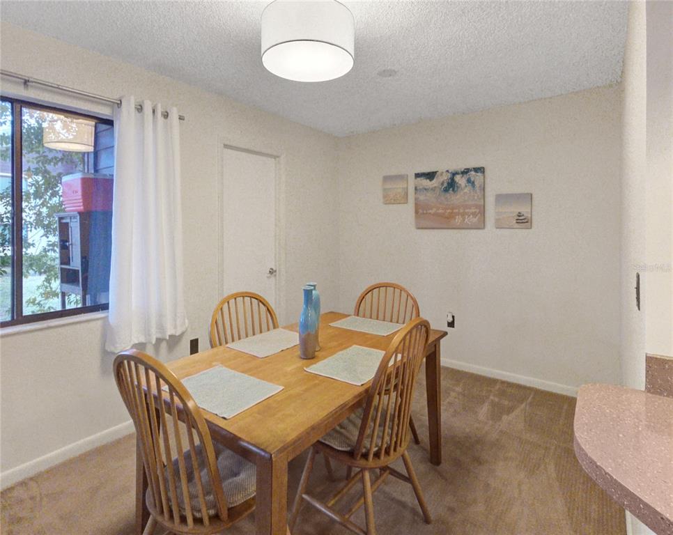 504 Silver Drive, Unit A Ocala, FL 34472 - Photo 8 of 28 a view of a dining room with furniture and window