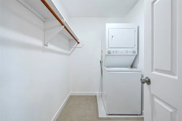 a view of hallway with washer and dryer