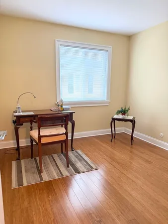 a bedroom with a bed and a table