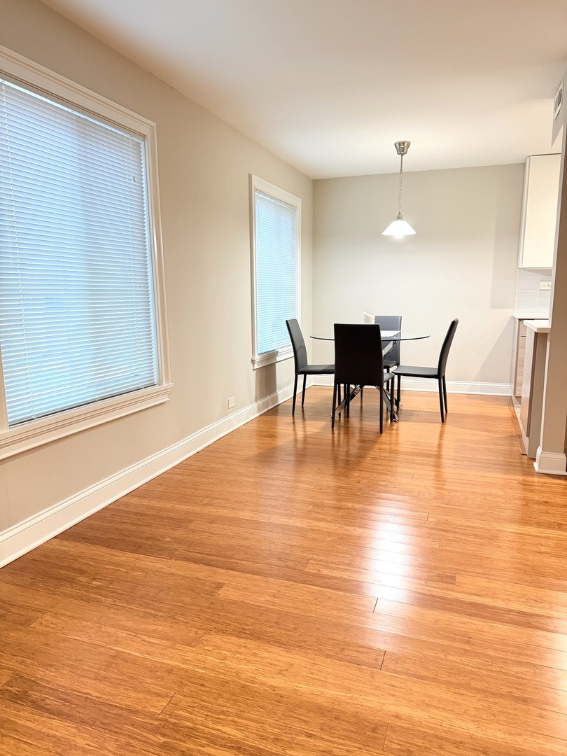 618 East Old Willow Road, Unit 183B Prospect Heights, IL 60070 - Photo 4 of 20 a view of a dining room with furniture and wooden floor
