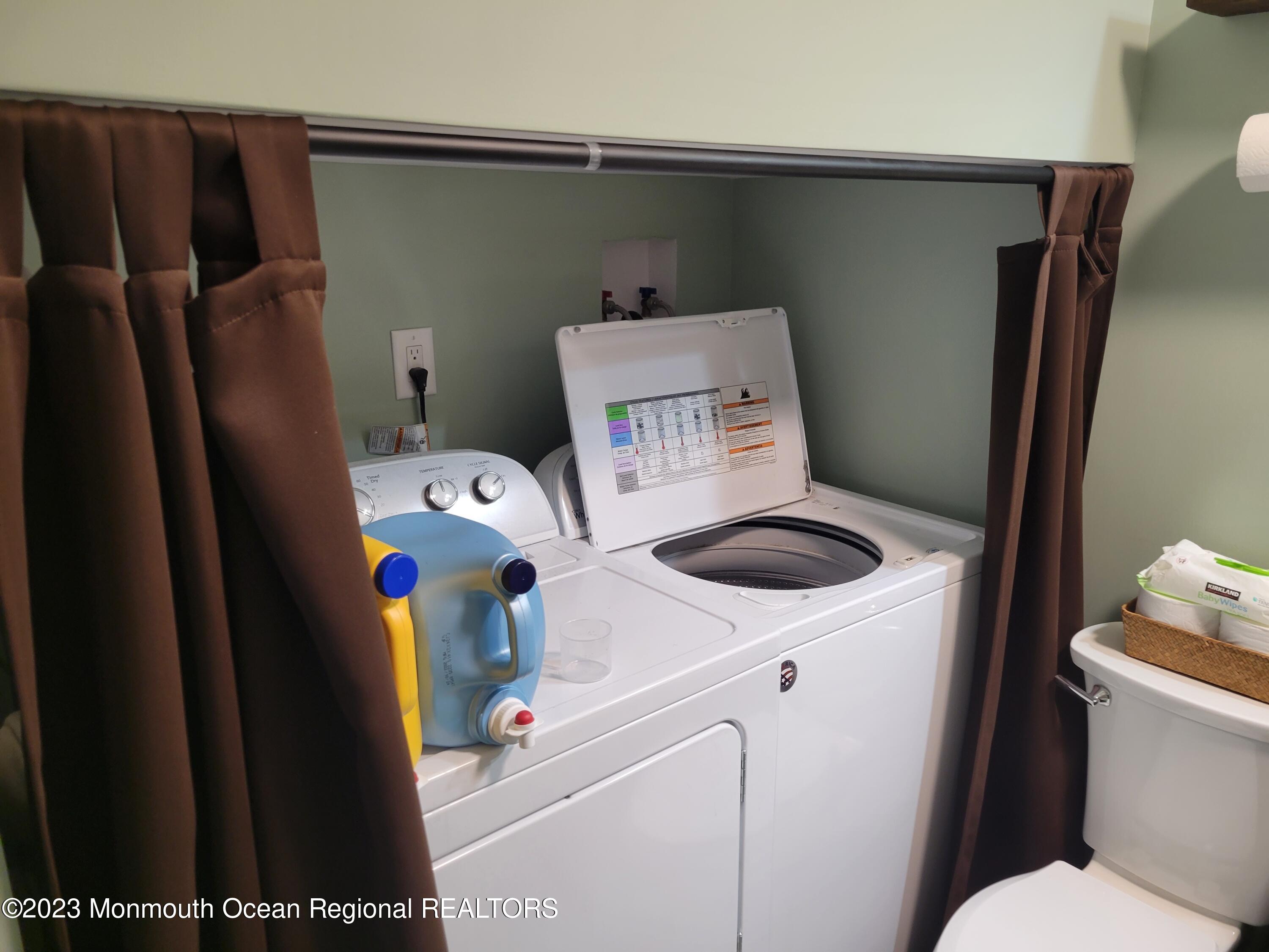 153 B Sunset Road, Unit 60 Manchester Township, NJ 08759 - Photo 11 of 15 a utility room with dryer and washer