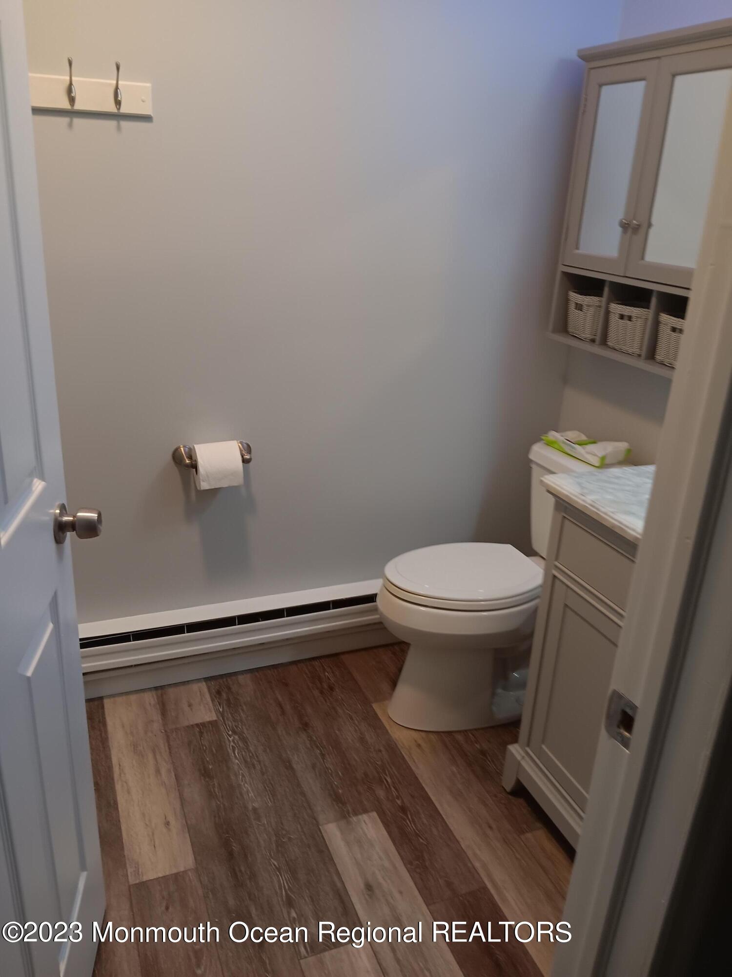 153 B Sunset Road, Unit 60 Manchester Township, NJ 08759 - Photo 13 of 15 a bathroom with a toilet and a shower