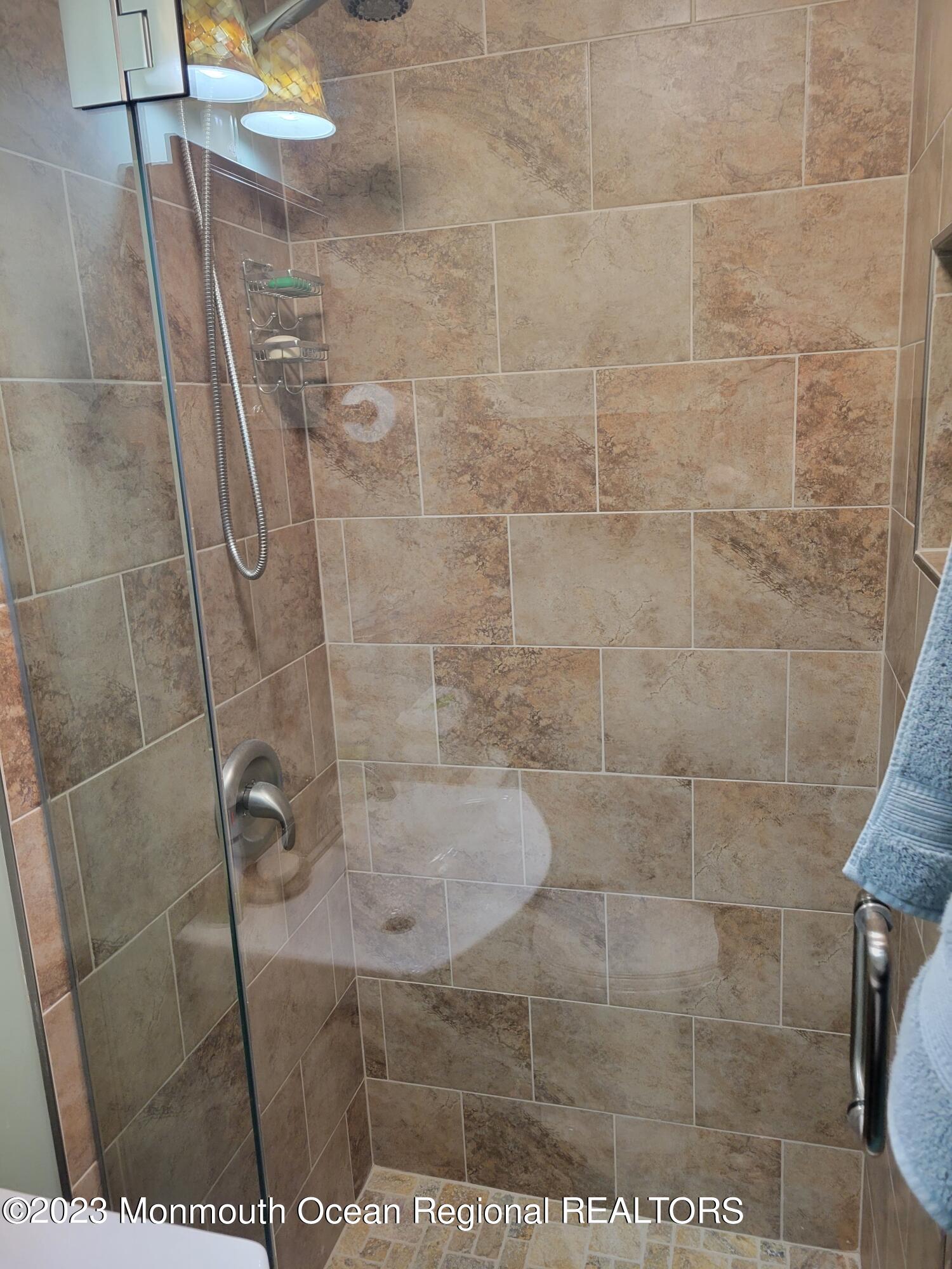 153 B Sunset Road, Unit 60 Manchester Township, NJ 08759 - Photo 10 of 15 a bathroom with a shower