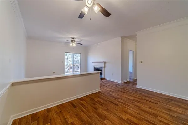 a view of a livingroom with wooden floor