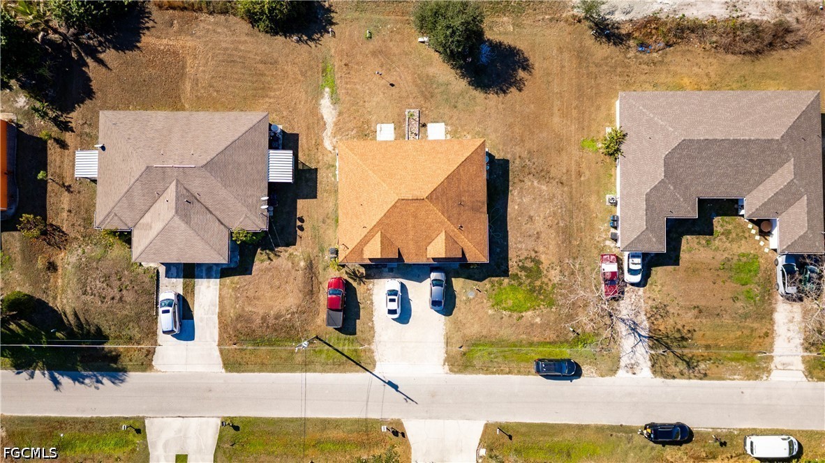 4519 25th Street Southwest Lehigh Acres, FL 33973 - Photo 22 of 24 an aerial view of houses with outdoor space