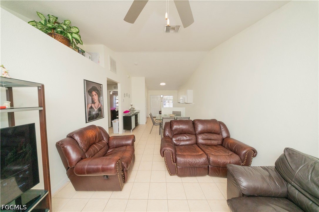 4519 25th Street Southwest Lehigh Acres, FL 33973 - Photo 4 of 24 a living room with furniture