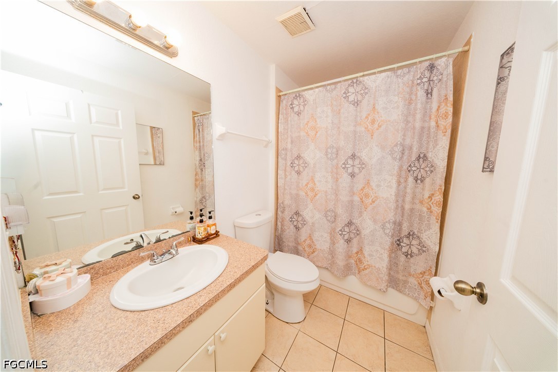4519 25th Street Southwest Lehigh Acres, FL 33973 - Photo 9 of 24 a bathroom with a sink toilet and shower