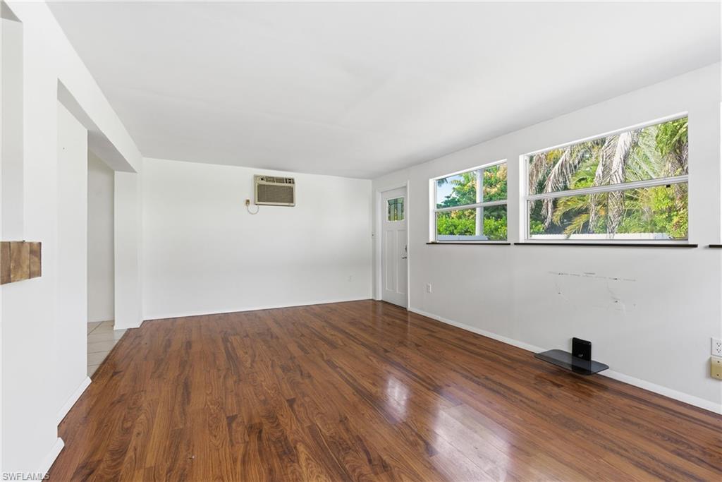 1235 Rordon Avenue Naples, FL 34103 - Photo 17 of 50 wooden floor in an empty room with a window