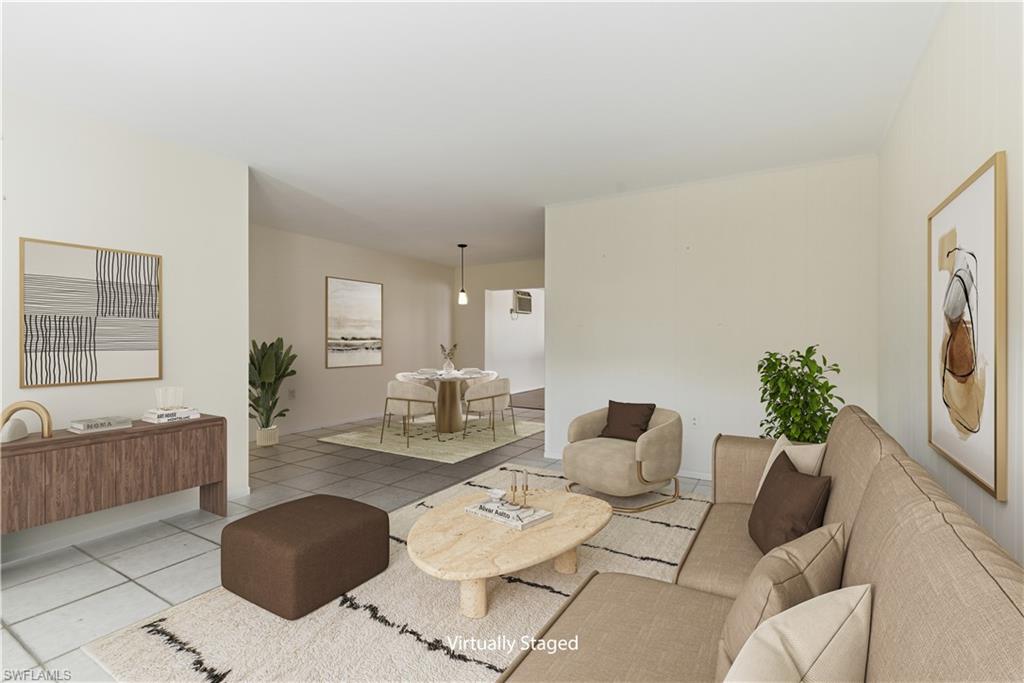 1235 Rordon Avenue Naples, FL 34103 - Photo 2 of 50 a living room with furniture and a table