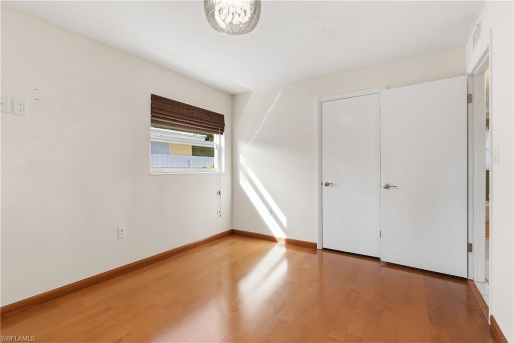 1235 Rordon Avenue Naples, FL 34103 - Photo 25 of 50 a view of an empty room with a window
