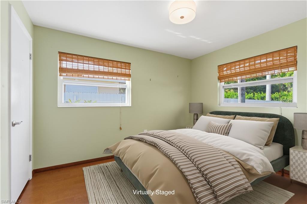 1235 Rordon Avenue Naples, FL 34103 - Photo 28 of 50 a bedroom with a bed and a window