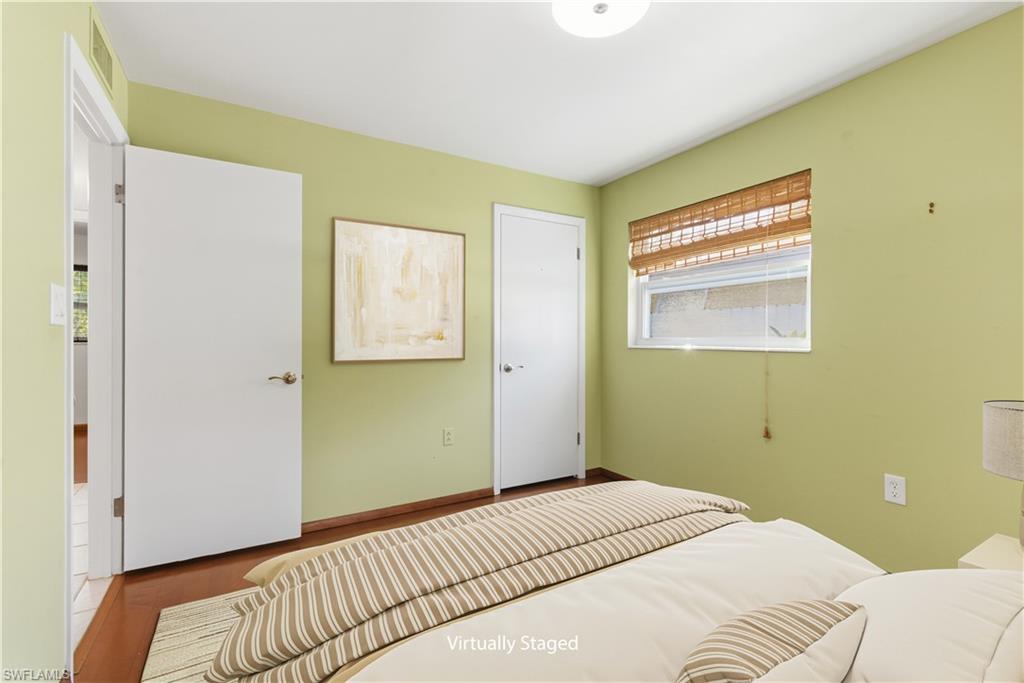 1235 Rordon Avenue Naples, FL 34103 - Photo 30 of 50 a bedroom with a bed and a window