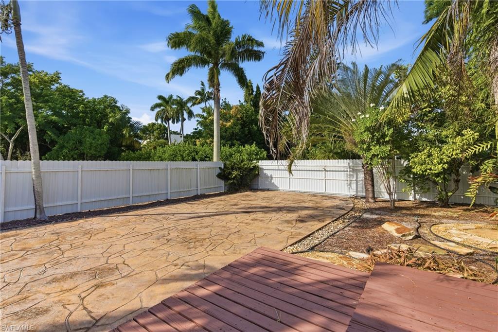 1235 Rordon Avenue Naples, FL 34103 - Photo 38 of 50 a backyard of a house with lots of green space