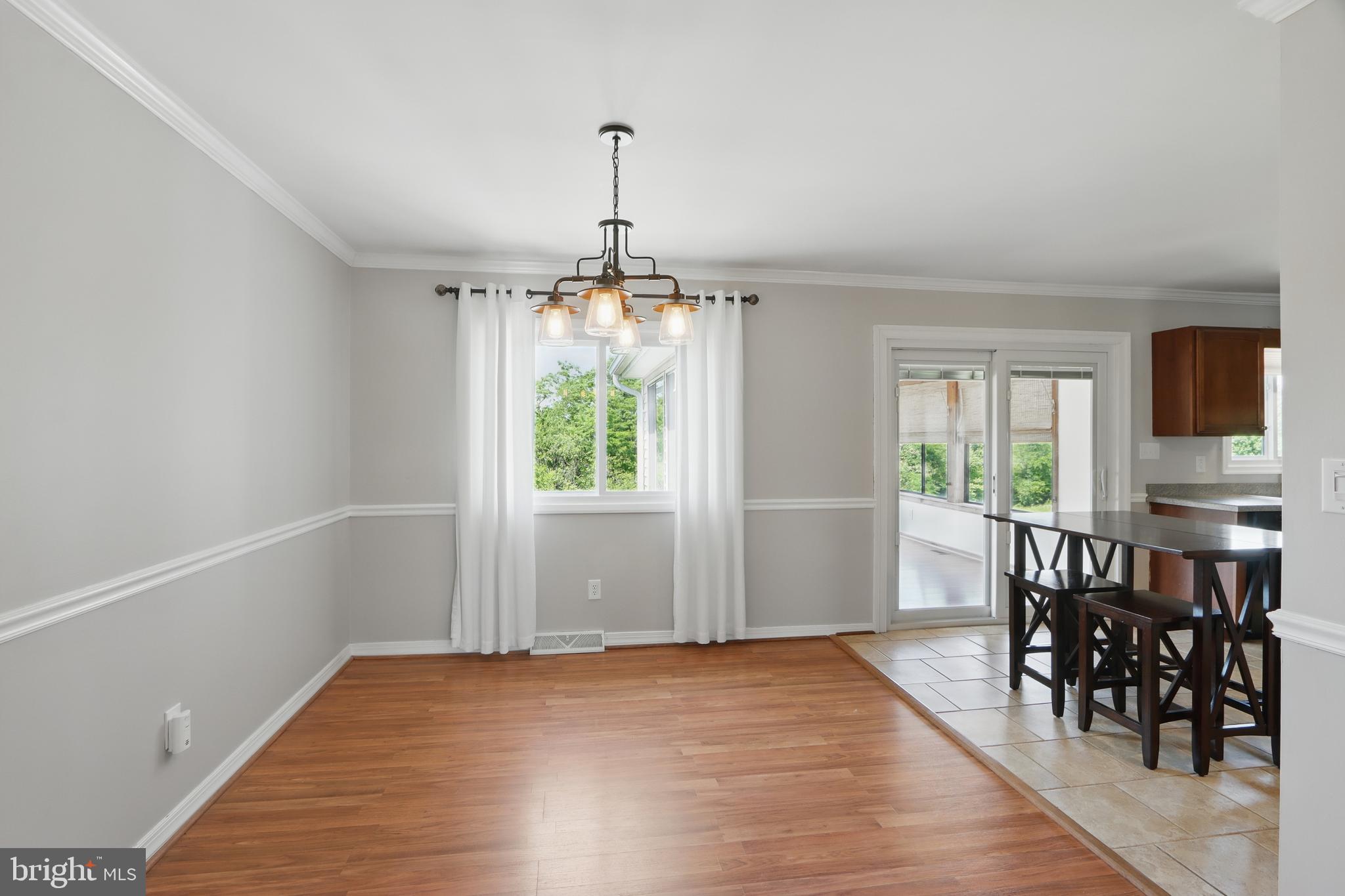 13228 Jesse Smith Road Mount Airy, MD 21771 - Photo 14 of 47 wooden floor in an empty room with a window