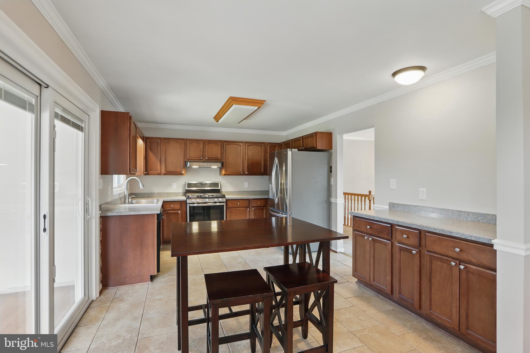 13228 Jesse Smith Road Mount Airy, MD 21771 - Photo 16 of 47 a kitchen with a table and chairs in it