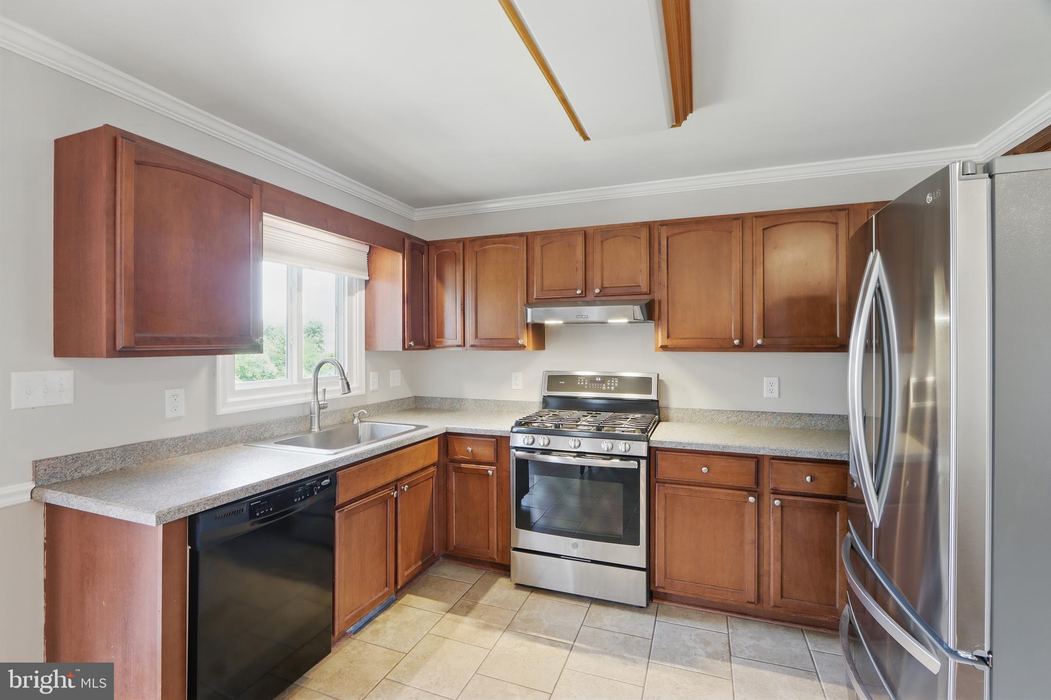 13228 Jesse Smith Road Mount Airy, MD 21771 - Photo 17 of 47 a kitchen with stainless steel appliances granite countertop a sink stove and refrigerator