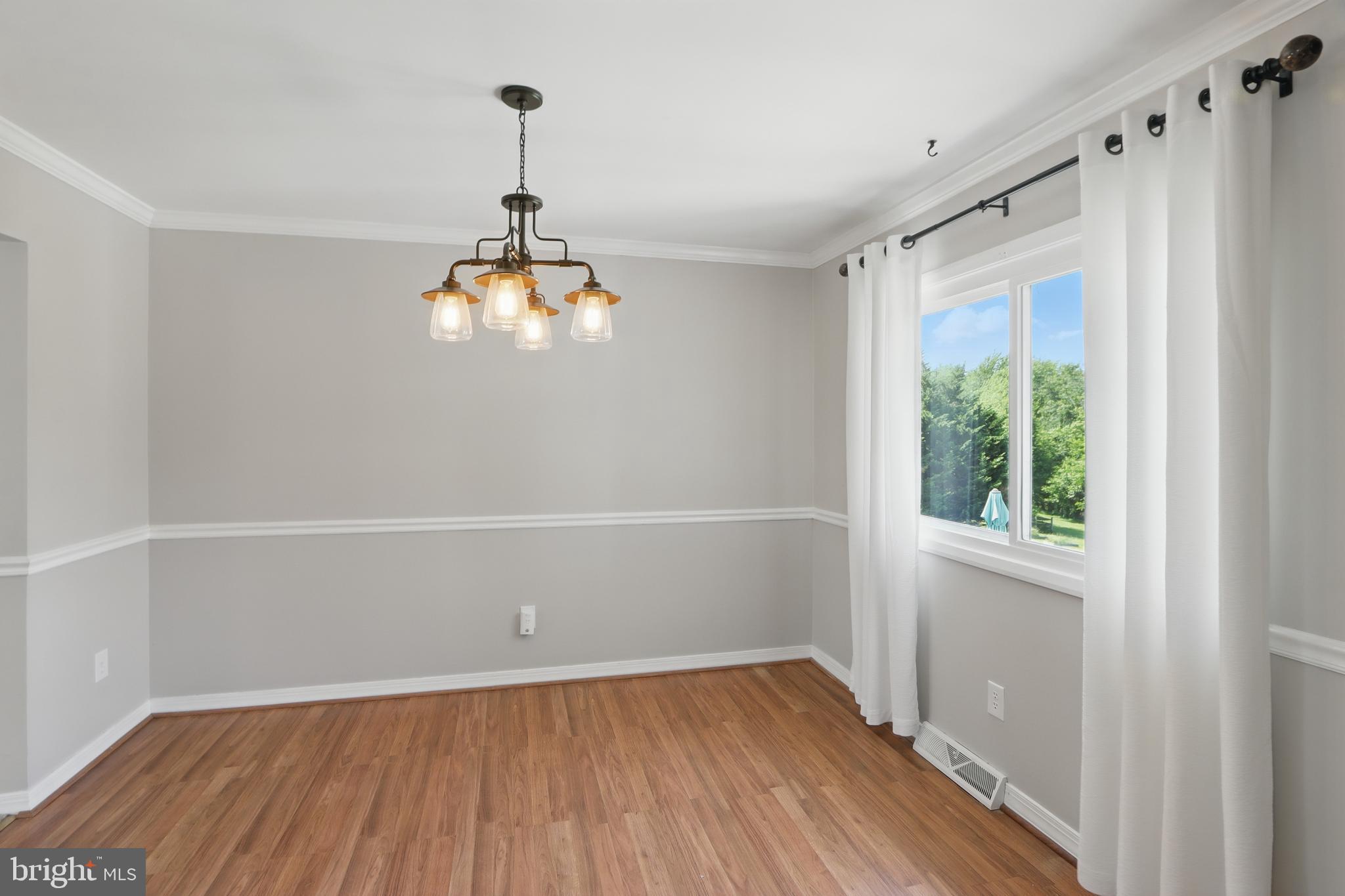 13228 Jesse Smith Road Mount Airy, MD 21771 - Photo 20 of 47 a view of empty room with wooden floor and fan