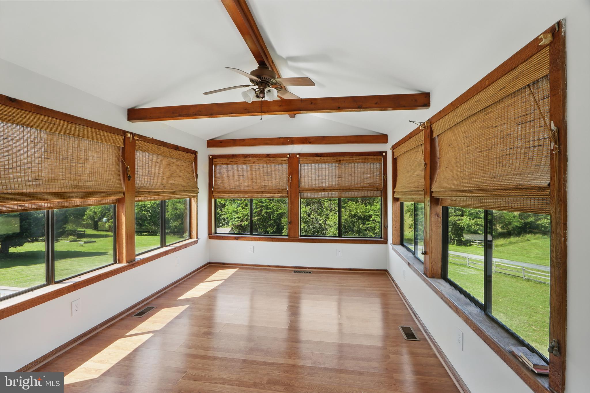 13228 Jesse Smith Road Mount Airy, MD 21771 - Photo 21 of 47 a view of empty room with wooden floor and fan