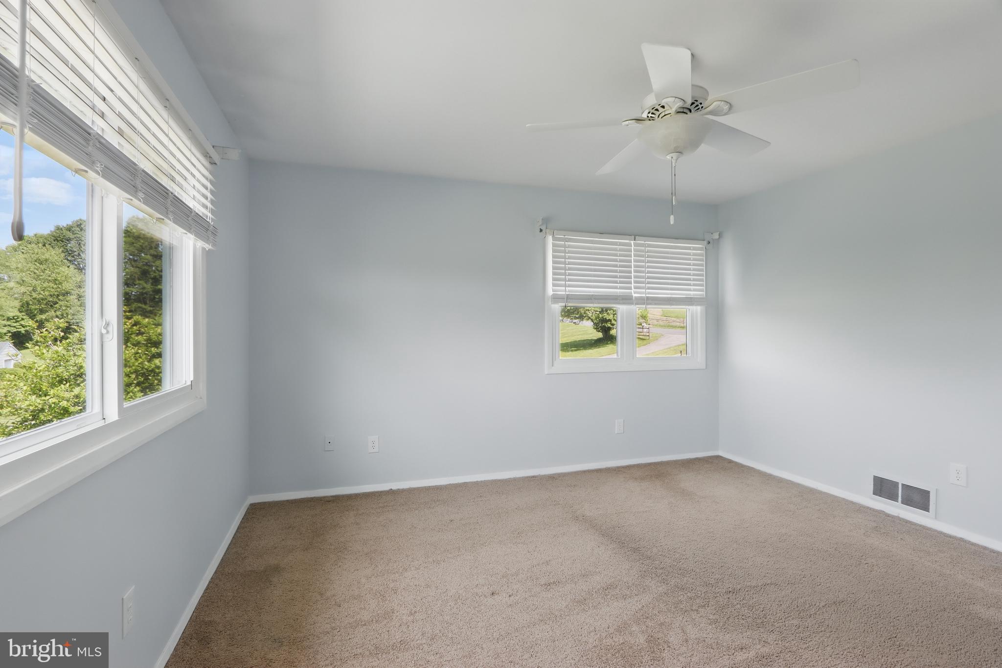 13228 Jesse Smith Road Mount Airy, MD 21771 - Photo 24 of 47 an empty room with windows and fan