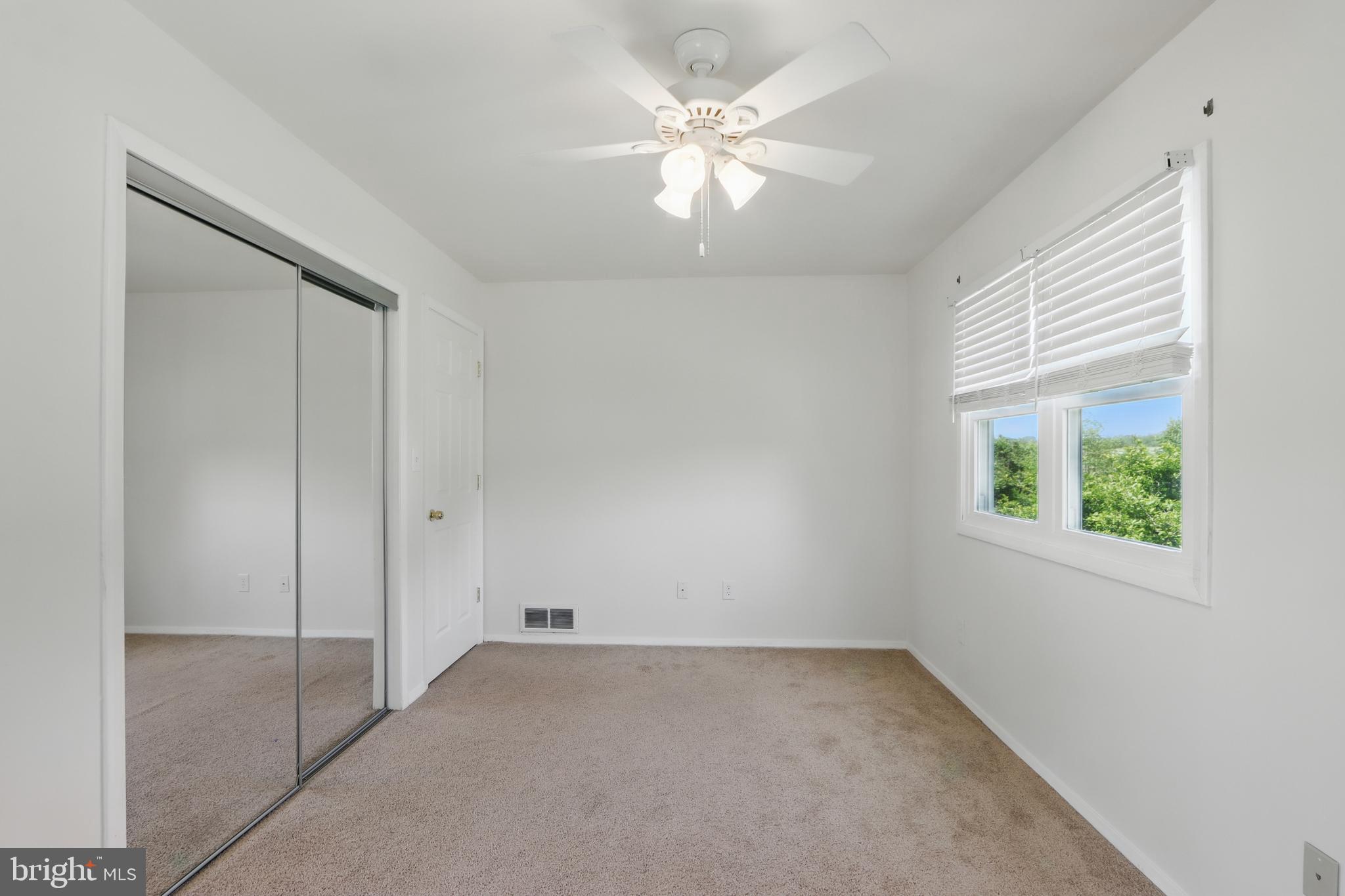 13228 Jesse Smith Road Mount Airy, MD 21771 - Photo 27 of 47 an empty room with windows and closet