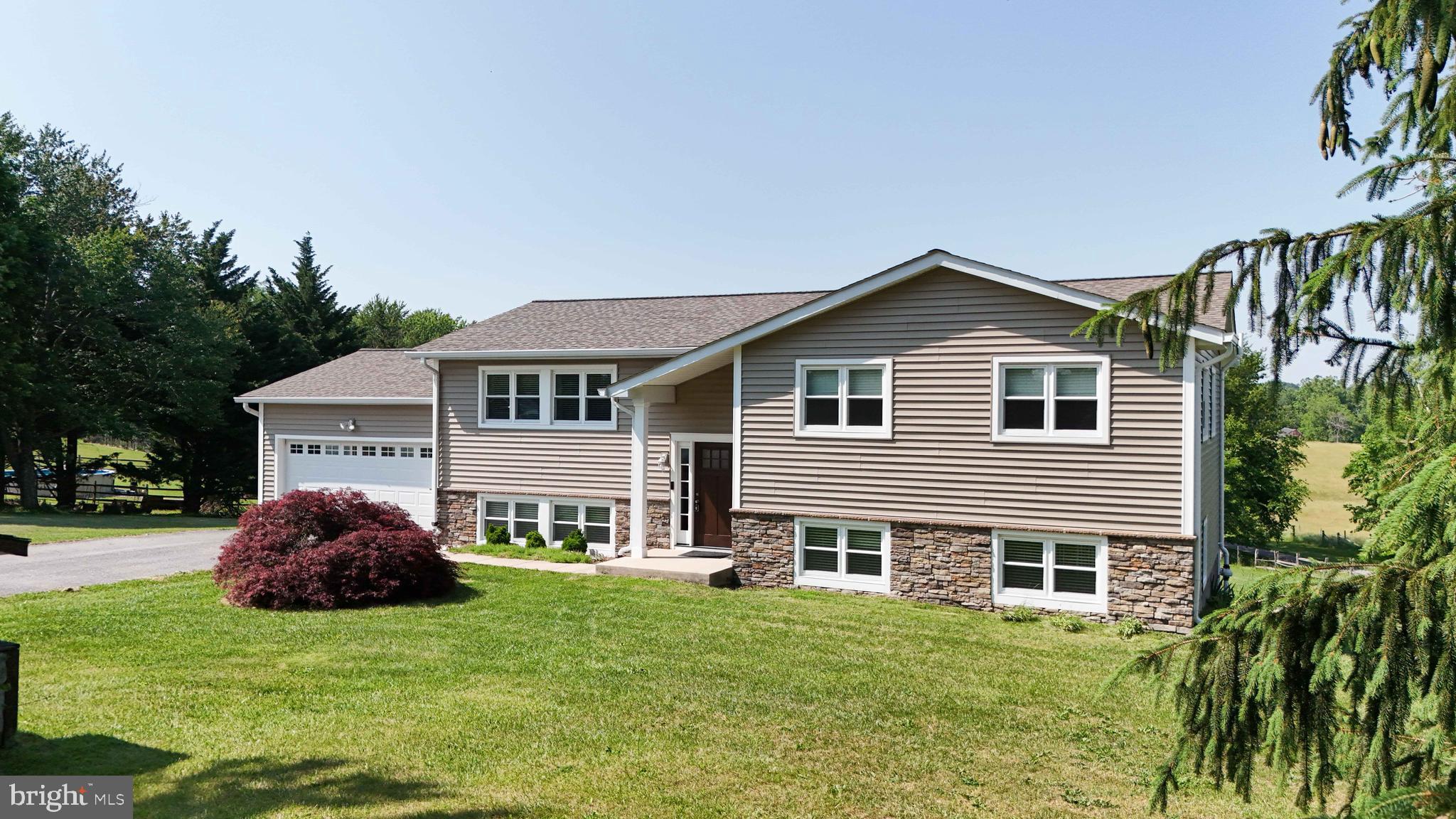 13228 Jesse Smith Road Mount Airy, MD 21771 - Photo 3 of 47 a house view with a garden space