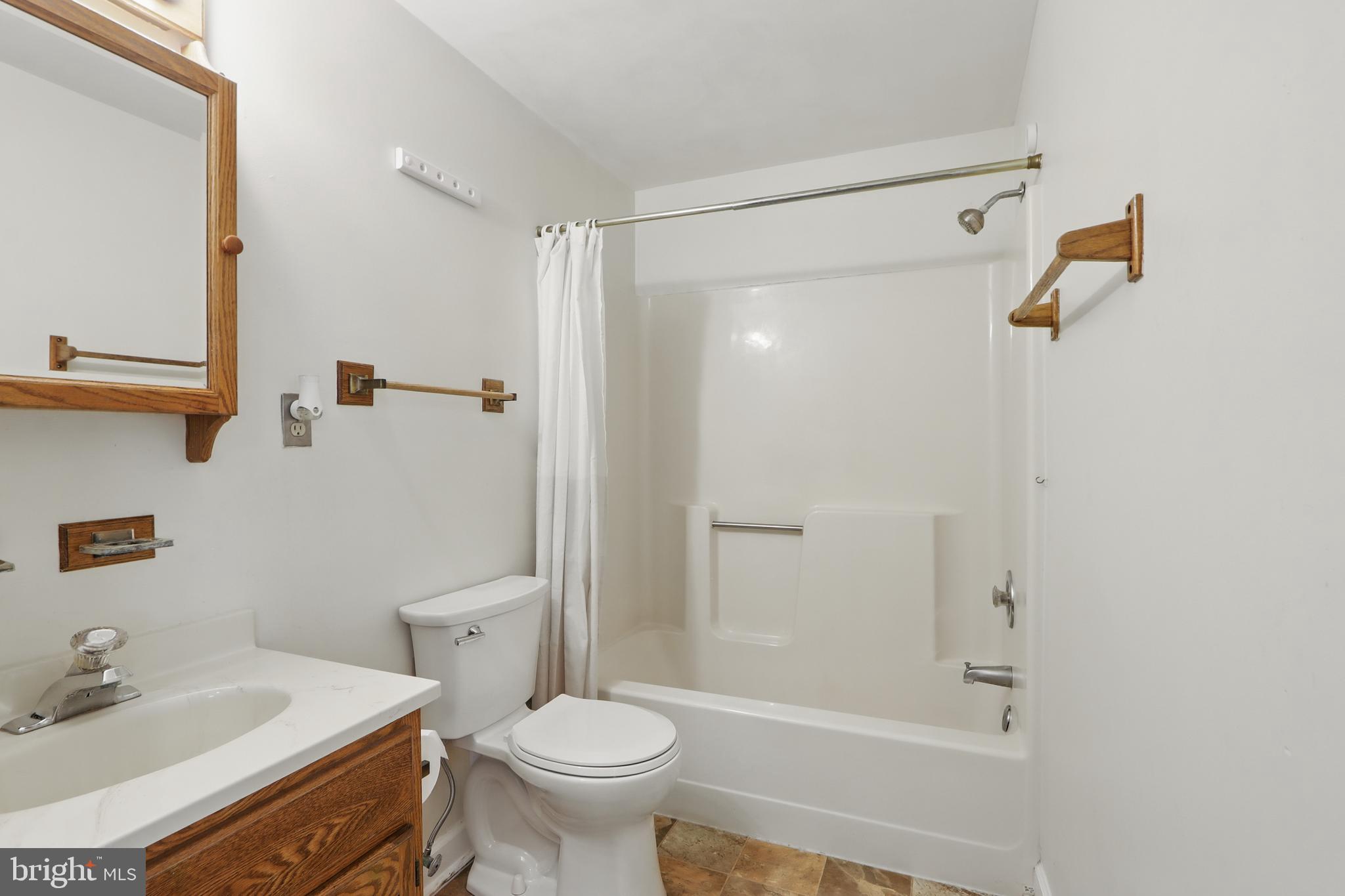 13228 Jesse Smith Road Mount Airy, MD 21771 - Photo 38 of 47 a bathroom with a sink toilet and shower