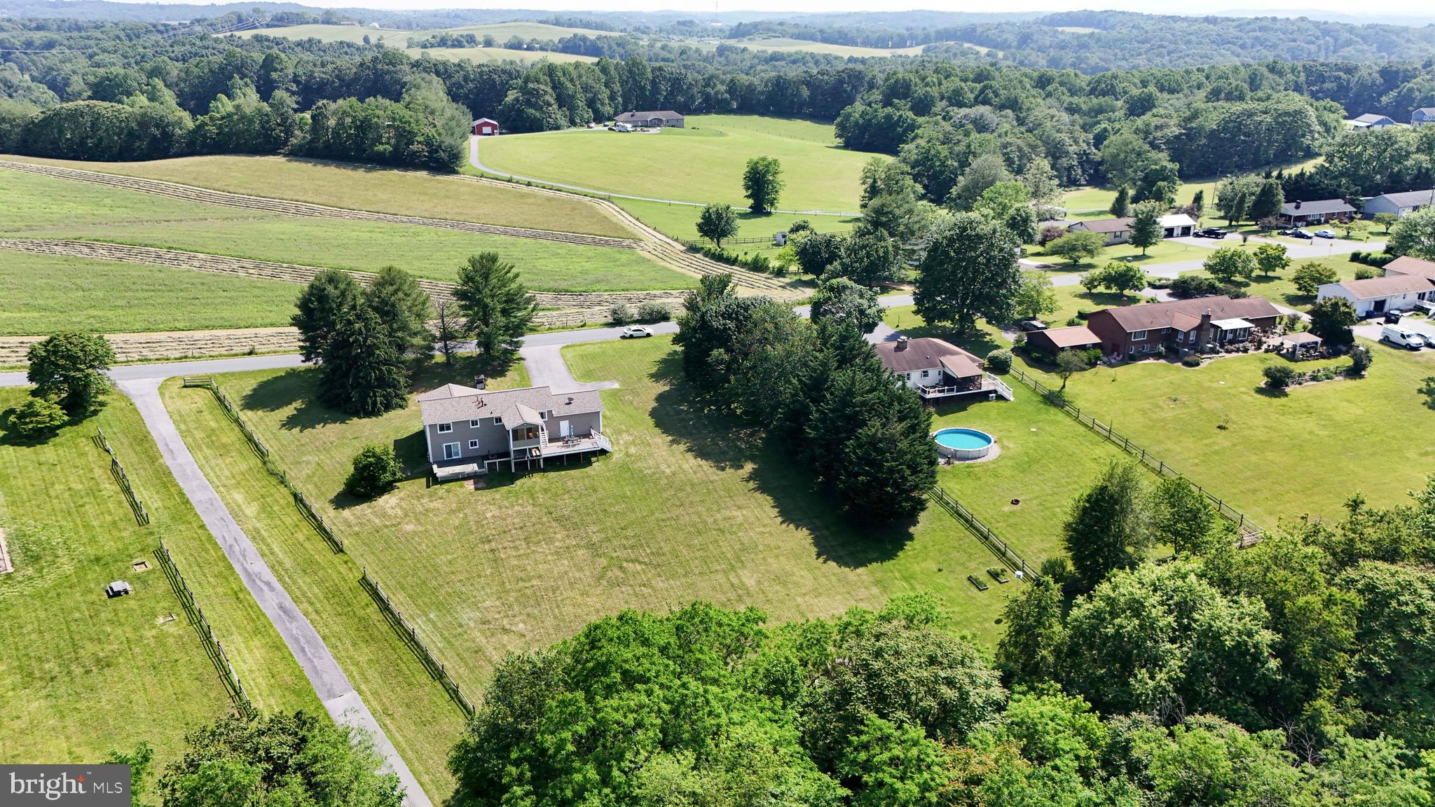 13228 Jesse Smith Road Mount Airy, MD 21771 - Photo 45 of 47 a view of a swimming pool with a yard