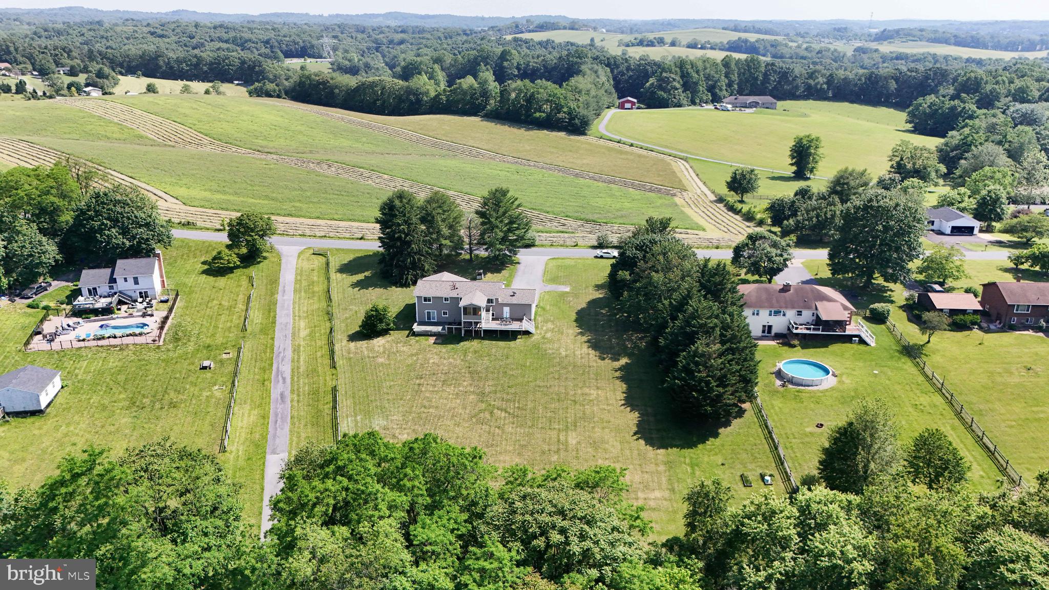 13228 Jesse Smith Road Mount Airy, MD 21771 - Photo 47 of 47 an aerial view of residential houses with outdoor space and swimming pool