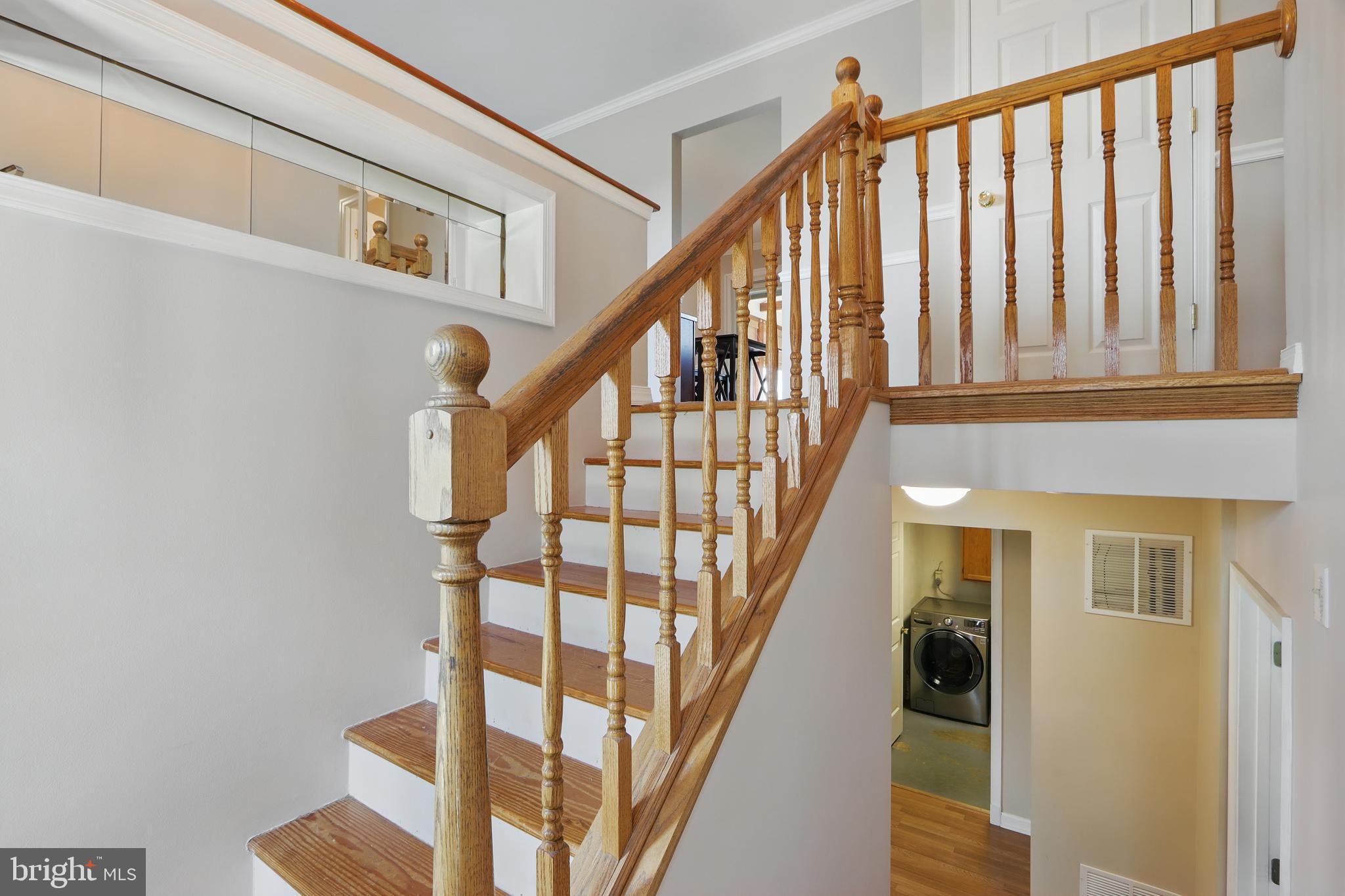 13228 Jesse Smith Road Mount Airy, MD 21771 - Photo 8 of 47 a view of staircase with lots of frames on wall and a window